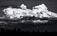 Large clouds over a dark Seattle